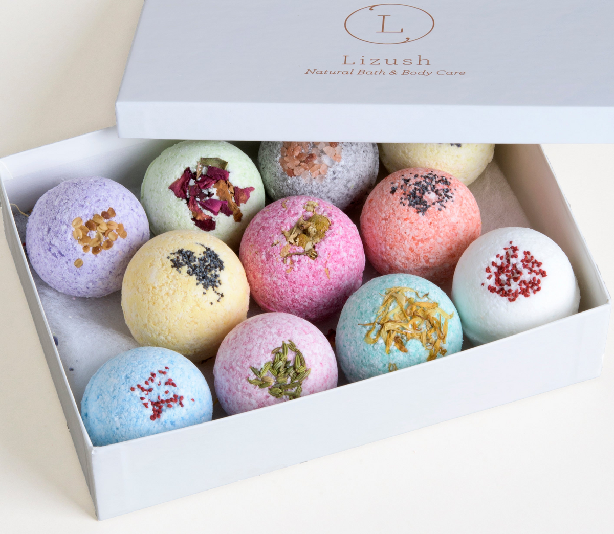 Open gift box filled with colorful bath bombs